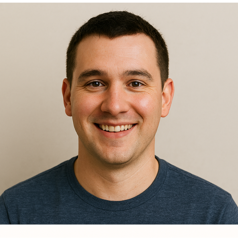 Man wearing a blue shirt against a beige background